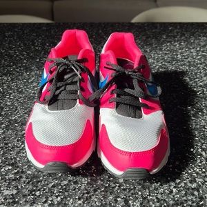 Nike tennis shoes hardly worn.   Like new.  Cute and bright